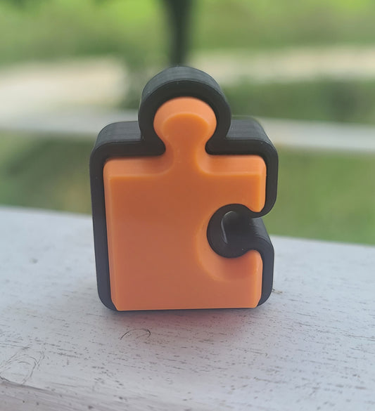 3d Printed Orange Puzzle Piece Clicker